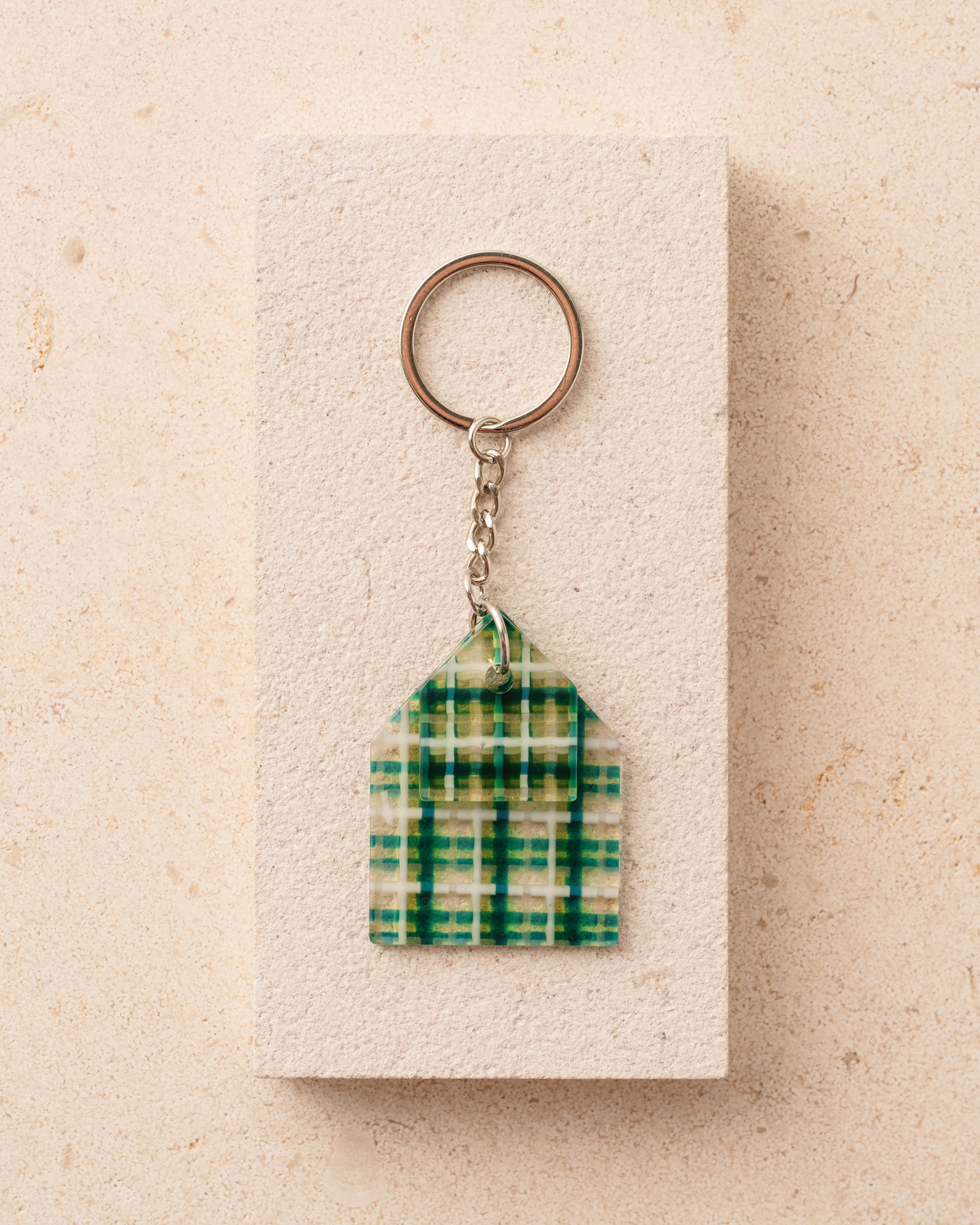 Keychain with green plaid design