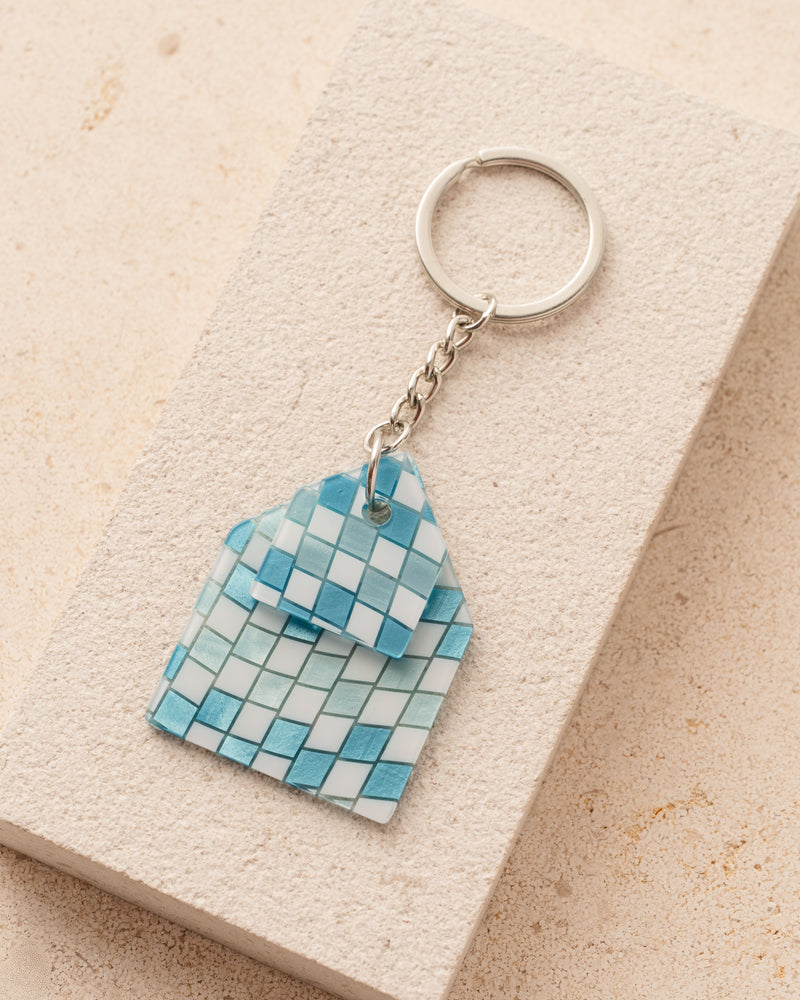 Keychain with a blue and white checkered design 