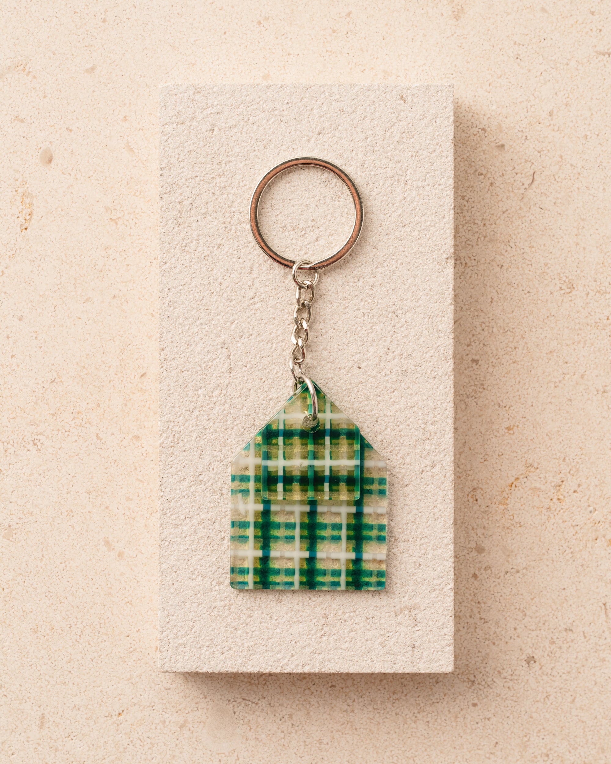 Keychain with green plaid design