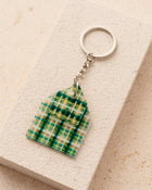 Keychain with a green and yellow checkered design 